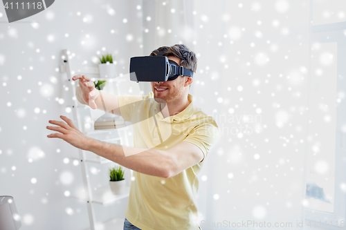 Image of young man in virtual reality headset or 3d glasses