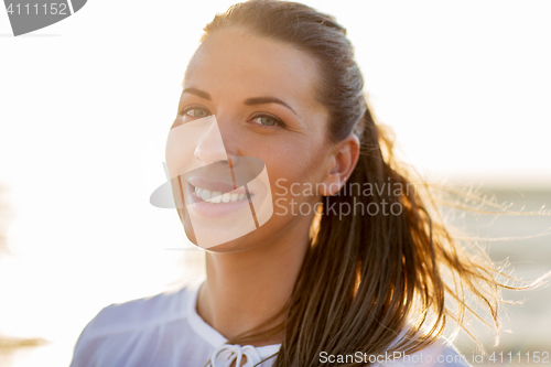 Image of happy smiling young woman face outdoors