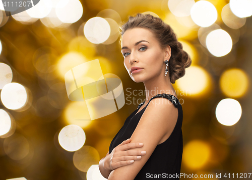 Image of woman in evening dress and earring