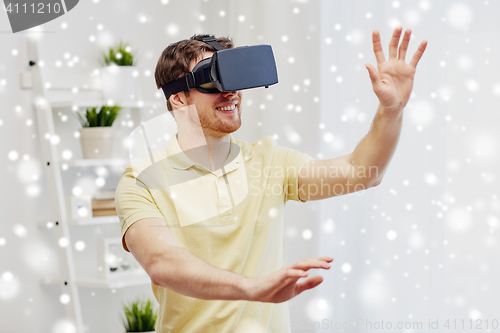 Image of young man in virtual reality headset or 3d glasses