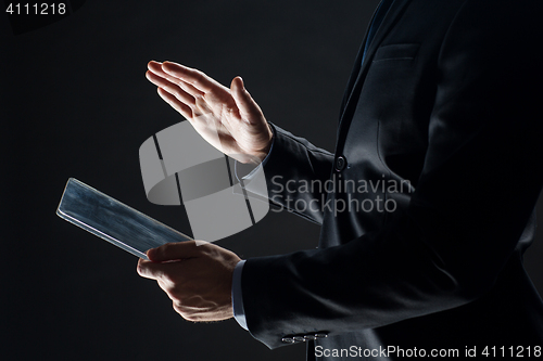 Image of close up of businessman with transparent tablet pc