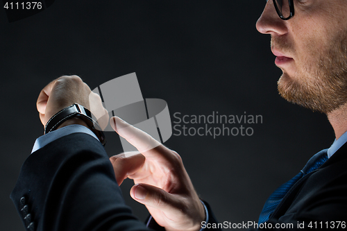 Image of close up of businessman with smart watch