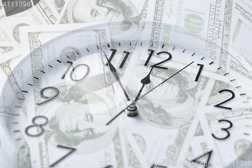 Image of clock over money with double exposure