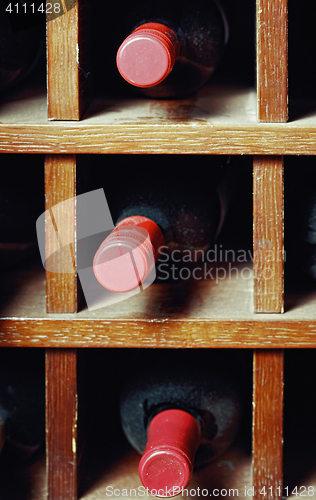 Image of Cells with three wine bottles