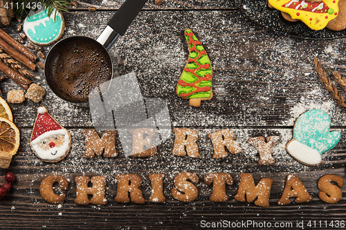 Image of Gingerbreads and coffee for new years or christmas