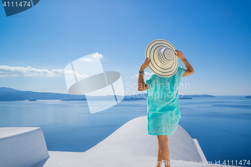 Image of Young woman on holidays, Santorini Oia town 