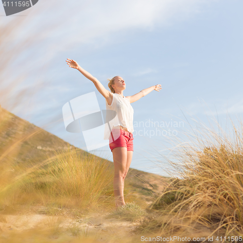 Image of Free Happy Woman Enjoying Sun on Vacations.