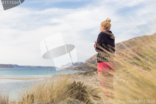 Image of Free Happy Woman Enjoying Last Autumn Sun on Vacations.