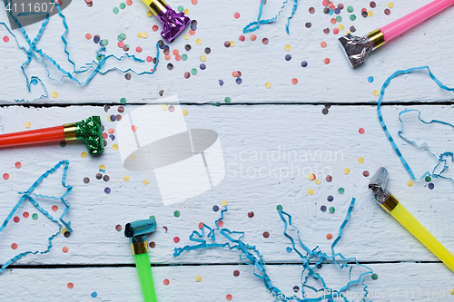 Image of Whistles, confetti on wooden background
