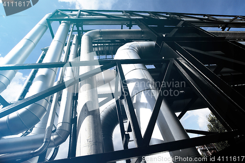 Image of different size and shaped pipes and valves at a power plant 