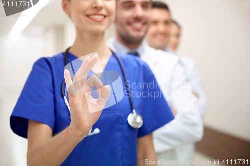 Image of close up of doctors at hospital showing ok sign