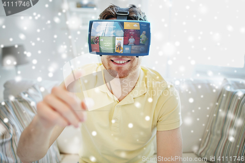 Image of young man in virtual reality headset or 3d glasses