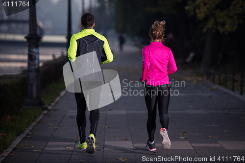 Image of young  couple jogging