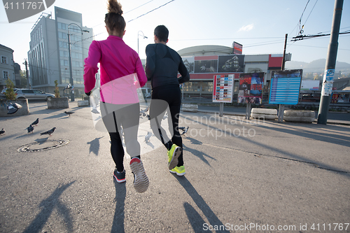 Image of young  couple jogging