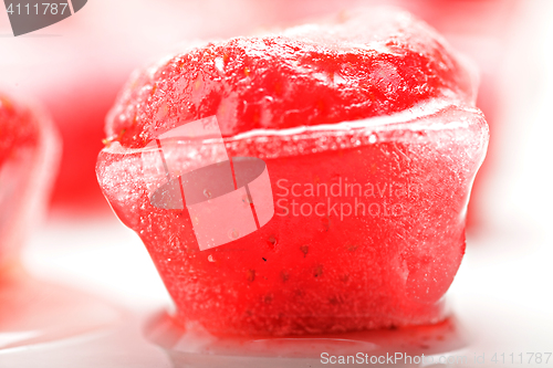 Image of Strawberry in ice cube closeup