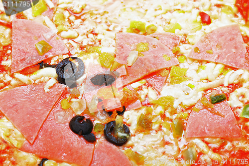 Image of Pizza with ham closeup