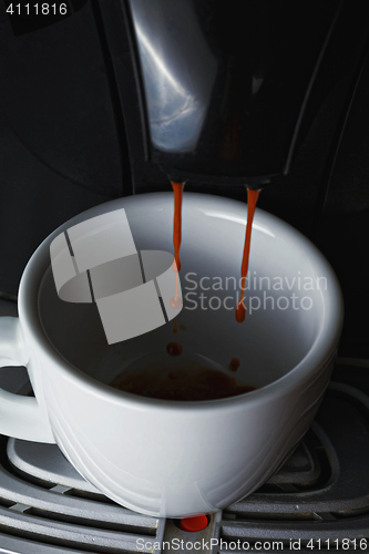 Image of Coffee pouring into white cup