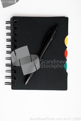 Image of notepad with pen isolated