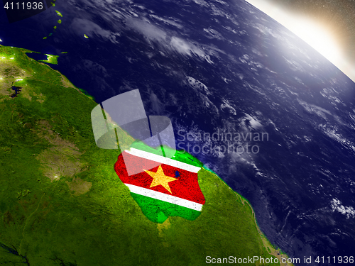 Image of Suriname with flag in rising sun