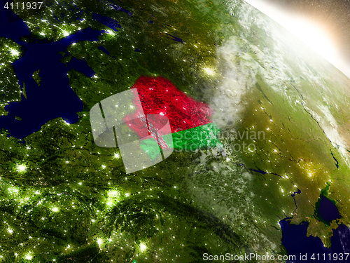 Image of Belarus with flag in rising sun