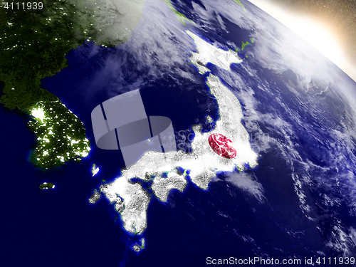 Image of Japan with flag in rising sun