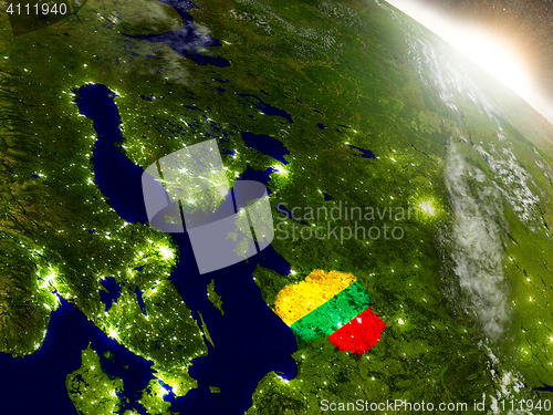 Image of Lithuania with flag in rising sun