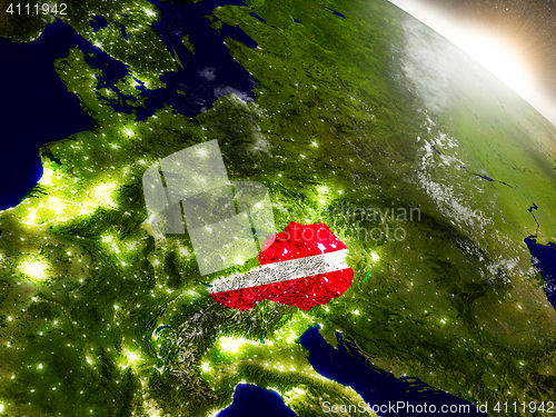 Image of Austria with flag in rising sun