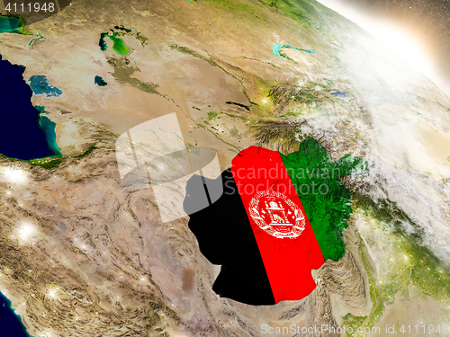 Image of Afghanistan with flag in rising sun