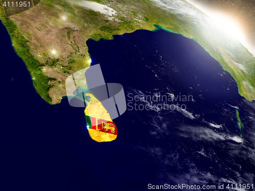 Image of Sri Lanka with flag in rising sun