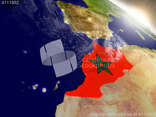 Image of Morocco with flag in rising sun