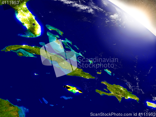 Image of Jamaica with flag in rising sun