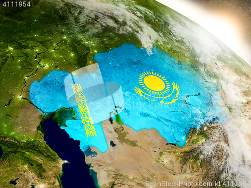 Image of Kazakhstan with flag in rising sun