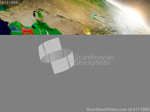 Image of Turkmenistan with flag in rising sun