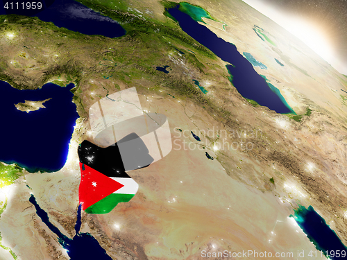 Image of Jordan with flag in rising sun