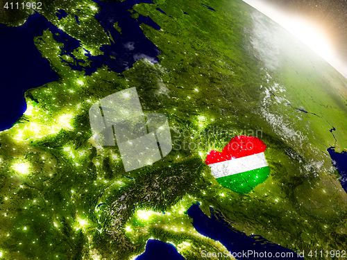 Image of Hungary with flag in rising sun