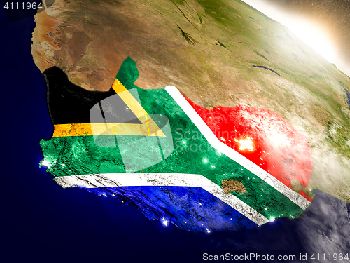 Image of South Africa with flag in rising sun