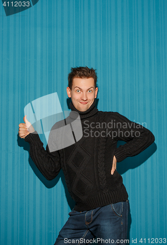 Image of Portrait of young man with serious facial expression