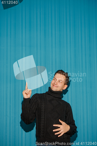 Image of Portrait of young man with serious facial expression