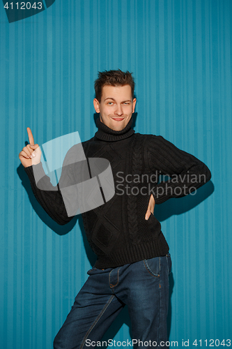 Image of Portrait of young man with serious facial expression