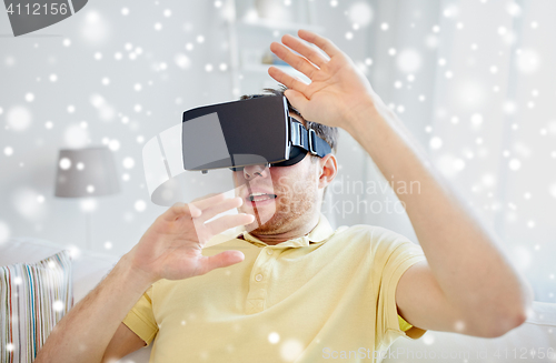 Image of young man in virtual reality headset or 3d glasses