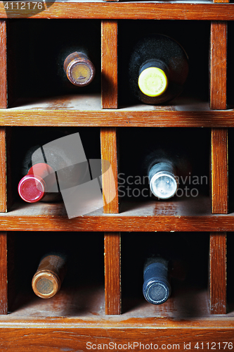 Image of Cells with six wine bottles