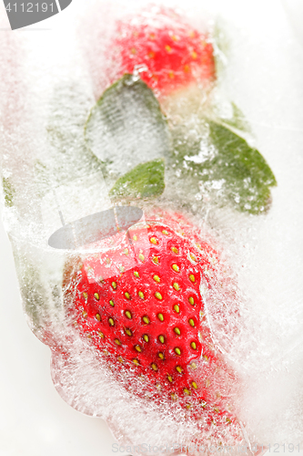 Image of Strawberries partially frosen in ice