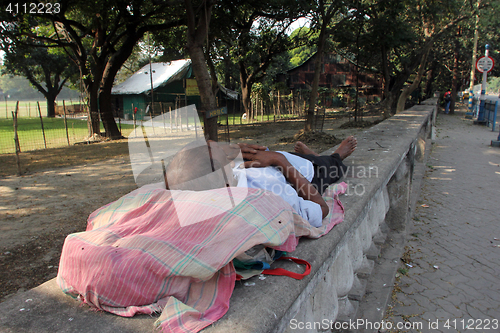 Image of Homeless people sleeping on the footpath of Kolkata