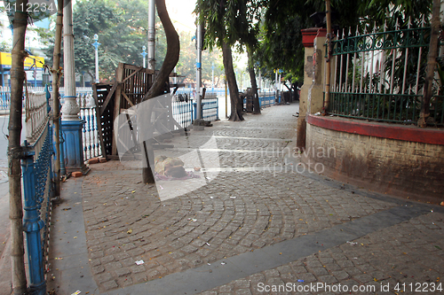 Image of Homeless people sleeping on the footpath of Kolkata