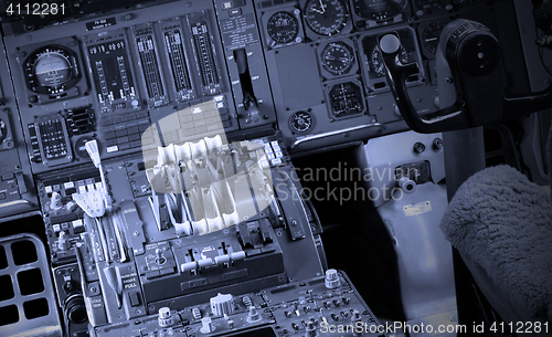 Image of Center console and throttles in airplane