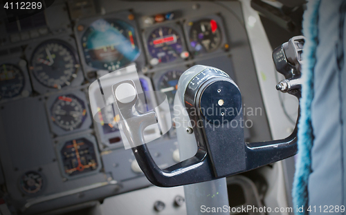 Image of Center console and throttles in airplane