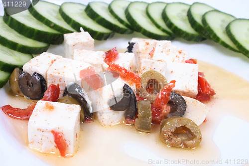 Image of cheese and vegetables on the white