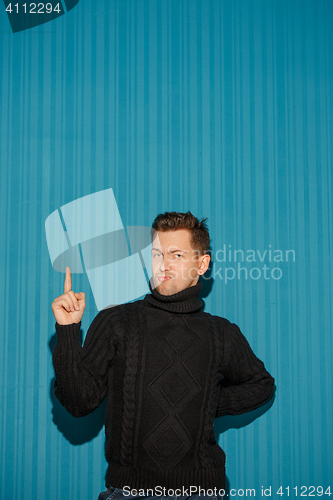 Image of Portrait of young man with serious facial expression