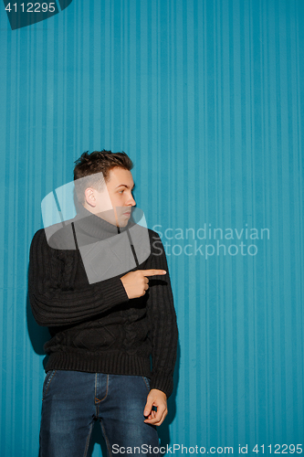 Image of Portrait of young man with serious facial expression