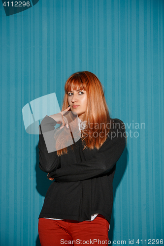 Image of Portrait of young woman with thoughtful facial expression